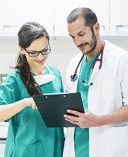 Doctor and Nurse Reviewing Records